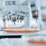 FINALLY: 3D Video Shows Cancer Being DESTROYED Automated laboratory equipment with robotic arms dispensing liquids into petri dishes