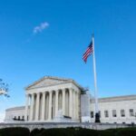 Supreme Court to Hear Catholic Preschool Case U.S. Supreme Court building with American flag and blue sky