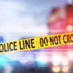 AUTOMATIC Gunfire Kills Teen at Prom Party Yellow police tape reading DO NOT CROSS at a crime scene