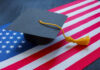 A graduation cap resting on an American flag