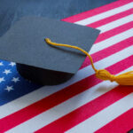 A graduation cap resting on an American flag