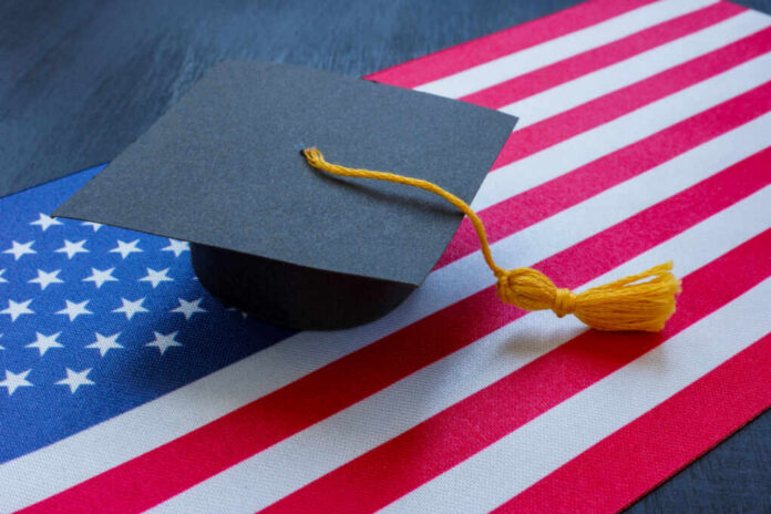 A graduation cap resting on an American flag