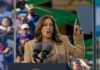 A woman passionately delivering a speech at a rally