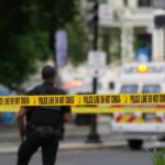Austin Shooting Chaos: Rumors Fly, Facts Lacking Police officers near a crime scene marked by caution tape