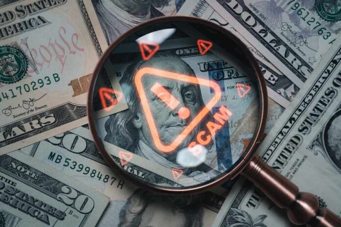 Magnifying,Glass,Focusing,On,Scam,Warning,Symbol,Over,Dollar,Bills Magnifying glass over U.S. dollar bills with a scam warning