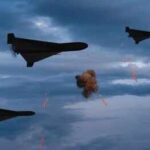 Israel-Iran Clash Enters Ominous New Phase Three military drones fly through a cloudy sky amid anti-air fire