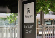 Sign indicating a rideshare pickup zone in an urban setting