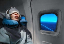 Toenail Chaos Exposes Airline Double Standard A passenger sleeping on an airplane with headphones and an eye mask