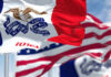 Iowa state flag prominently displayed with other flags in the background