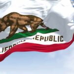 Career Politician Surges, Housing Still Burns California state flag featuring a bear and a star