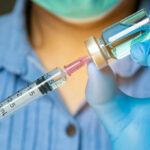 Anti-Aging Gold Rush Targets Men Healthcare professional preparing a syringe from a vial