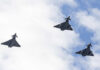 Russian Drone Triggers Alarms — Then This Three fighter jets flying in formation against a cloudy sky