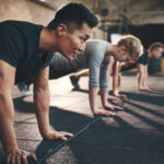 Coach’s Vanity Play Triggers Backlash Group of individuals performing push-ups in a gym