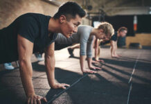 Coach’s Vanity Play Triggers Backlash Group of individuals performing push-ups in a gym