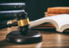 Judge Describes Horror, Then Offers Hope Judge's gavel on desk with open law book