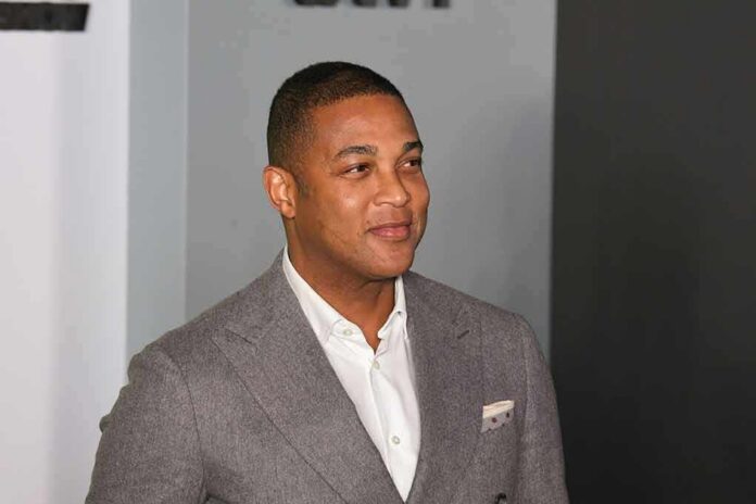 man in gray suit smiling at event