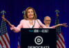 Party Civil War Over Israel Explodes A female politician speaking at a podium with Democratic Party branding