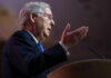 Politician delivering a speech with hand gestures