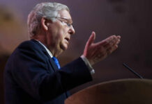 Politician delivering a speech with hand gestures