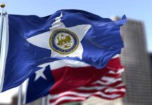 Houston city flag waving in front of other flags