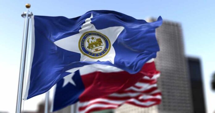 Houston city flag waving in front of other flags