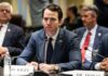 Anthropic Showdown Exposes Hidden Ban A man in a suit sitting at a table during a government hearing