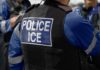 Wrong Guy Killed—ICE Pulls the Plug Close-up of a police officer's vest with 'POLICE ICE' label