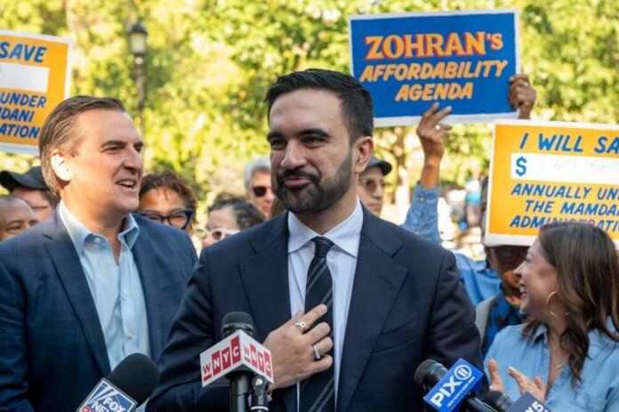 Democratic,New,York,City,Mayoral,Candidate,Zohran,Mamdani,Launches,A A politician speaking at a rally with supporters holding signs