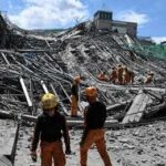 Kyiv Under Fire: Night Sky Turns Deadly Rescue workers search a collapsed building site