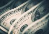 City’s $1.2M ‘No-Work’ Myth Unravels Close-up of folded hundred dollar bills