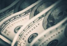 City’s $1.2M ‘No-Work’ Myth Unravels Close-up of folded hundred dollar bills